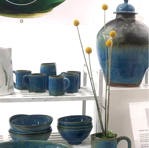 Blue stoneware bowls, cups and lidded vase