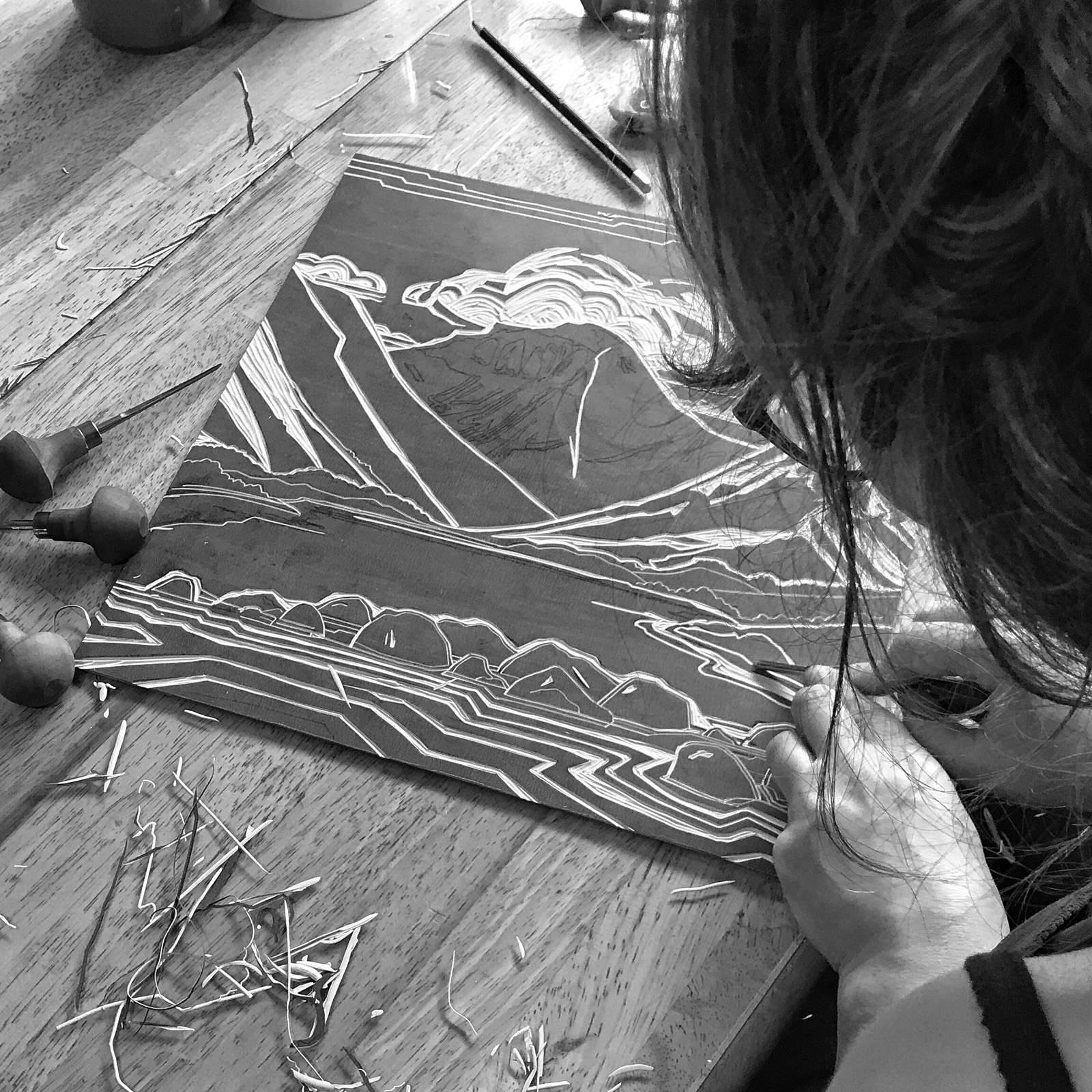 Emily Brooks carving a lino block