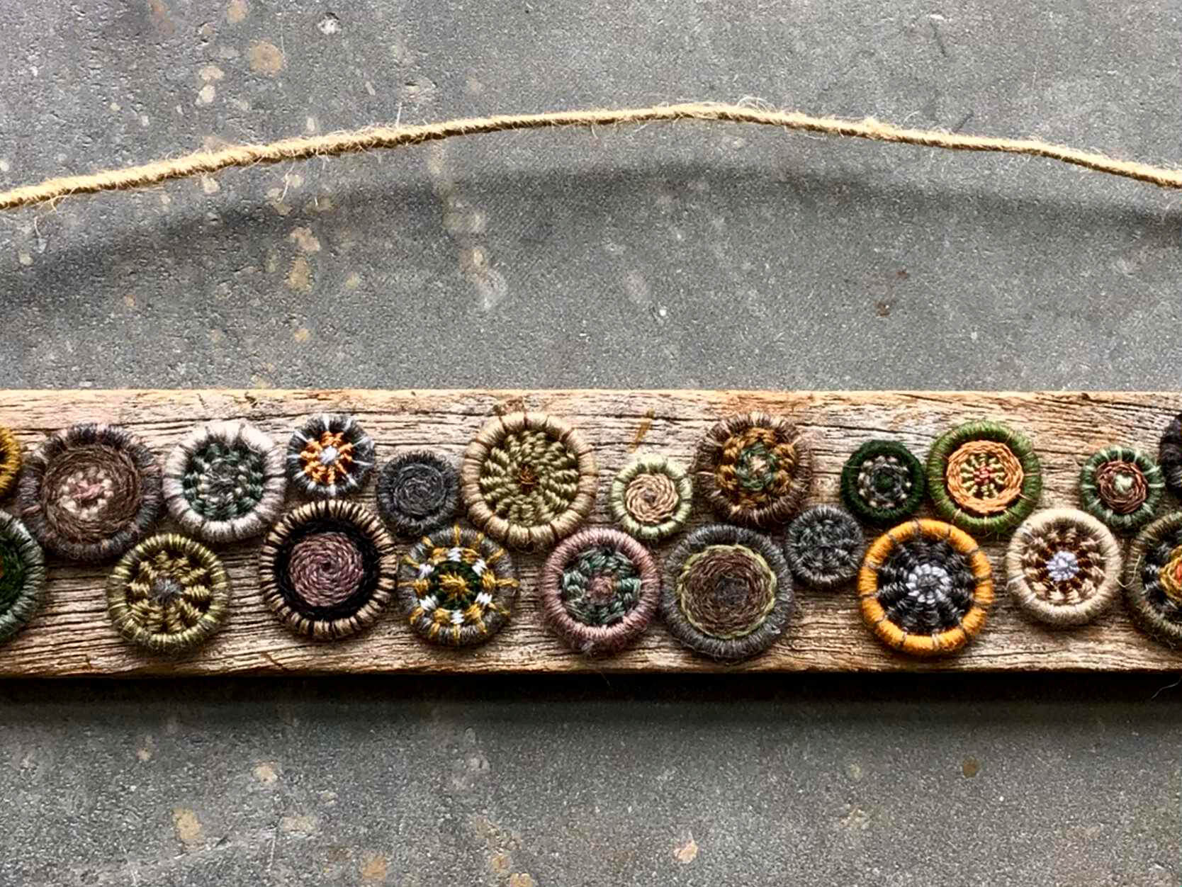 Dorset Buttons on Driftwood